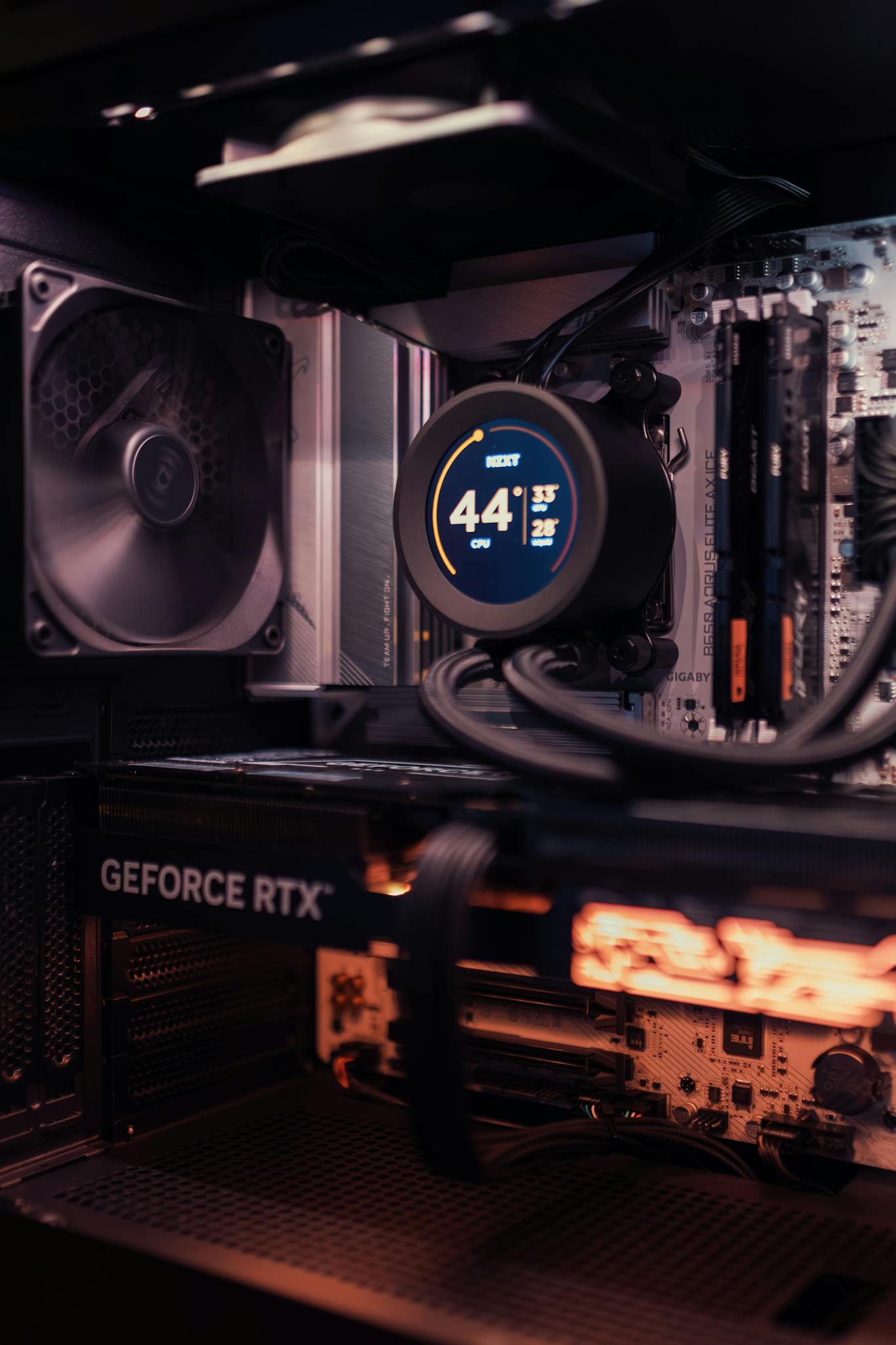Close-up of a gaming PC interior featuring a GeForce RTX and cooling system.