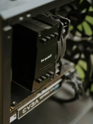 Detailed view of cooling and GPU components inside a desktop PC case. Perfect for technology enthusiasts.