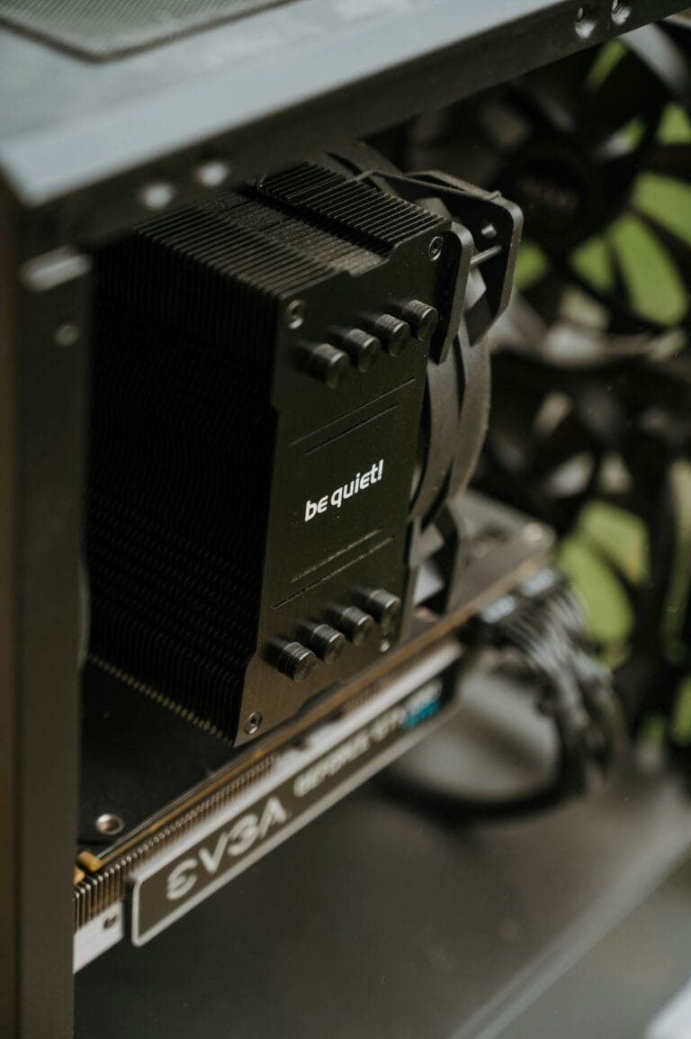 Detailed view of cooling and GPU components inside a desktop PC case. Perfect for technology enthusiasts.